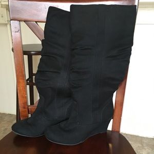 Knee high black boots.